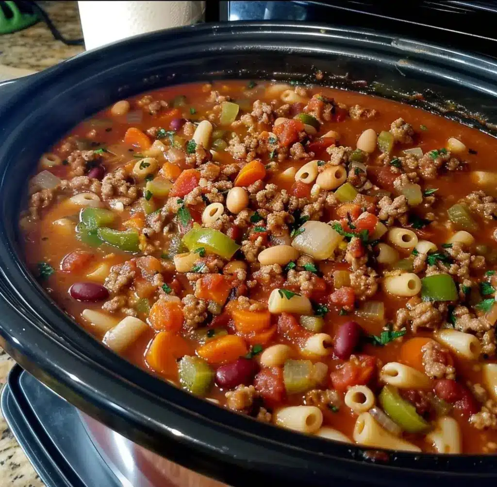 A finished bowl of Olive Garden Pasta Fagioli with parmesan and parsley