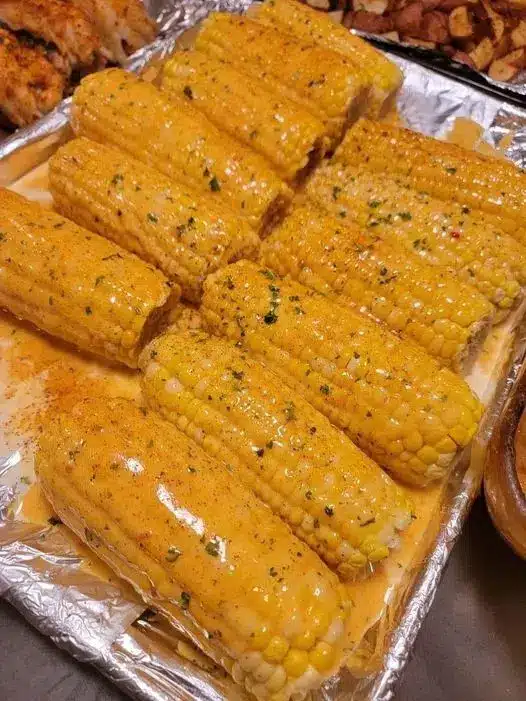 Close up of Mexican street corn with chili powder and cheese