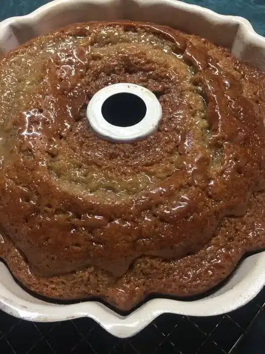 A slice of banana bundt cake showing the moist interior texture.