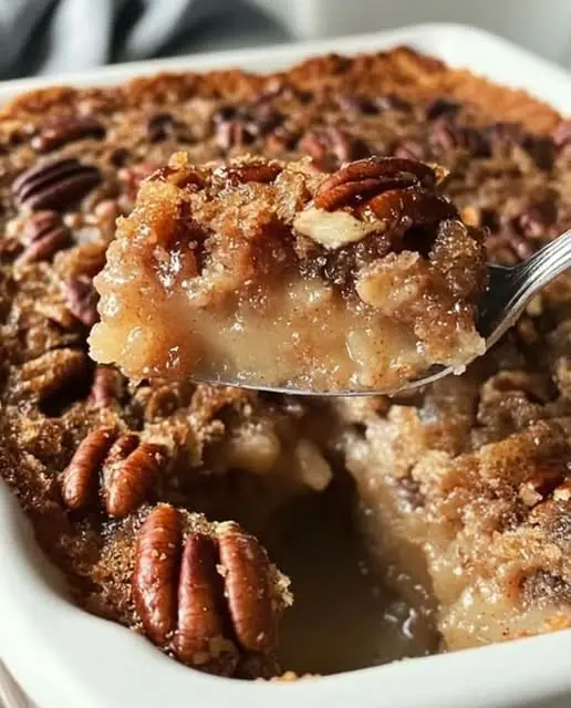 A stack of sliced chocolate pecan bars showing the gooey center and golden crust