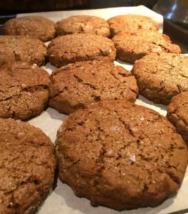 Stack of soft chewy molasses cookies showing the sugar coating