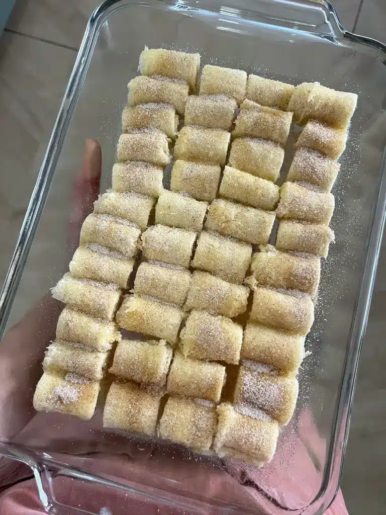 Close up of a single sugar snail pastry showing the intricate spiral layers