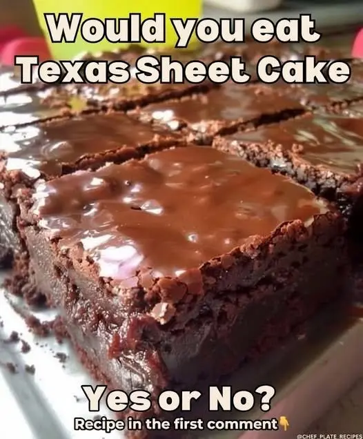 A close-up slice of moist Texas sheet cake being lifted from a baking pan.