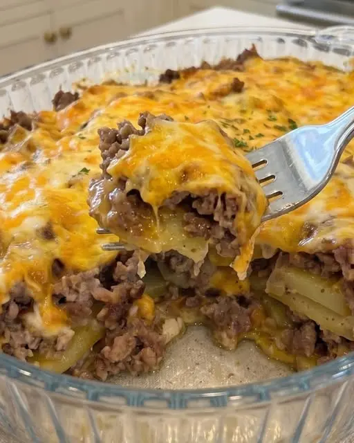 The finished cheesy hamburger potato casserole in a baking dish