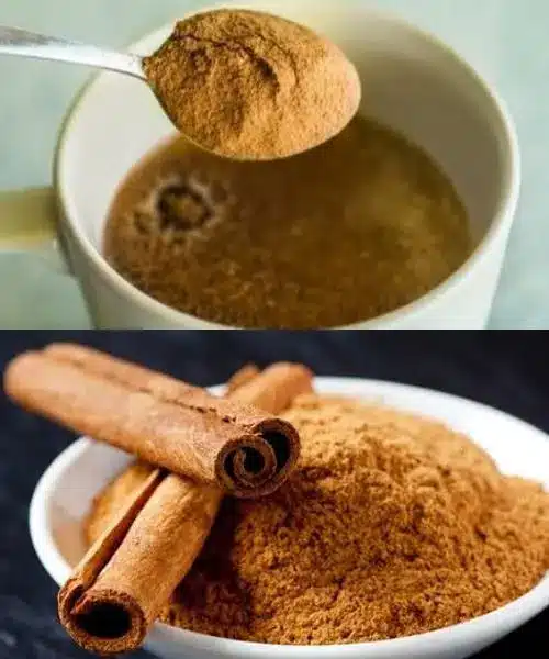 Ground cinnamon and coffee beans scattered next to a cup of tea.