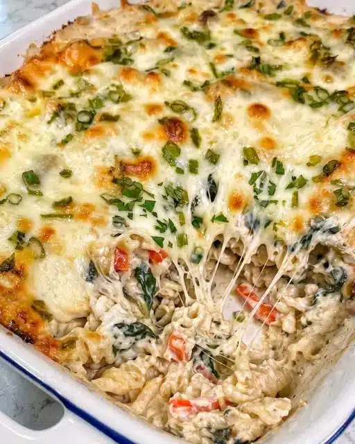 Finished bowl of creamy garlic herb cheesesteak pasta garnished with parsley