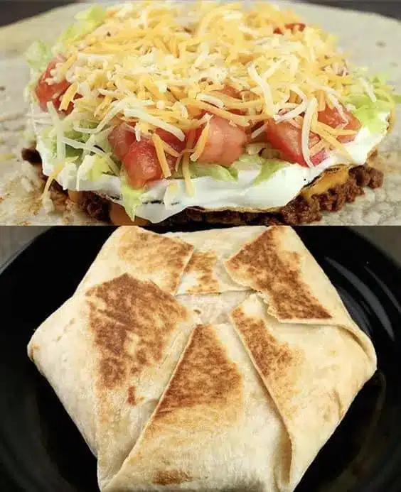 Finished homemade crunchwrap supreme cut in half showing the layers of beef, cheese, and vegetables
