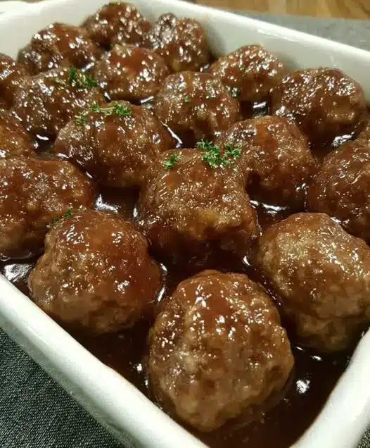 Honey garlic meatballs served over white rice with steamed broccoli.