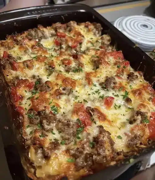 sliced square of baked sausage breakfast casserole on a white plate