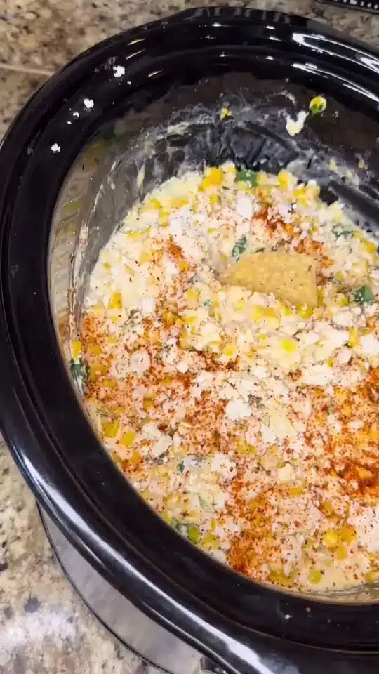 A serving of chicken casserole on a white plate with steam rising