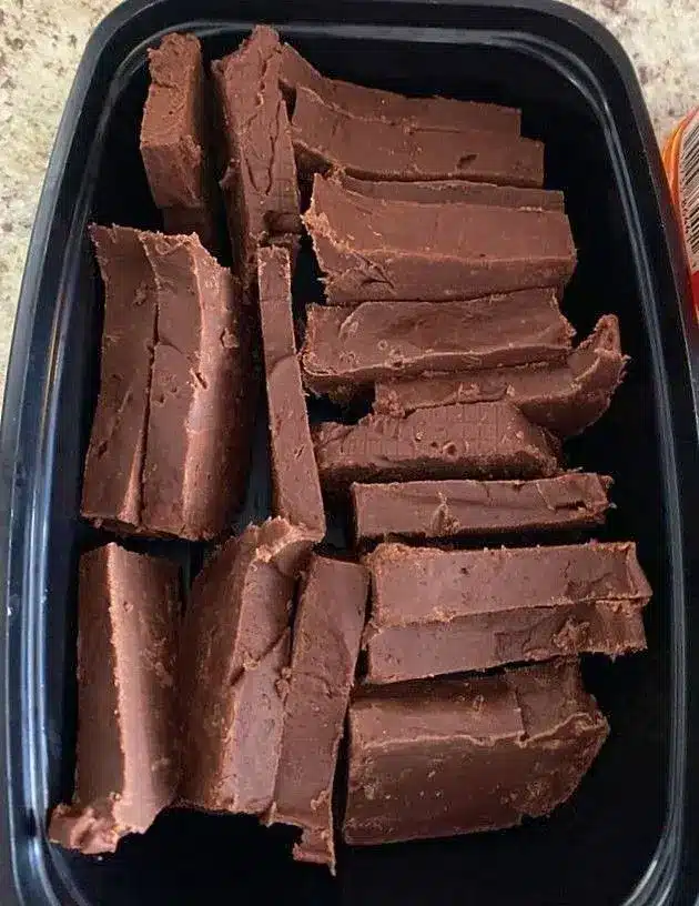 Slices of Fireball cinnamon fudge arranged on a wooden serving board