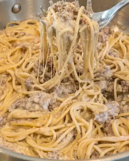 Finished ground beef alfredo pasta bake in a baking dish