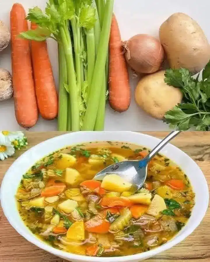 A served bowl of gut healing vegetable soup with fresh herbs and lemon