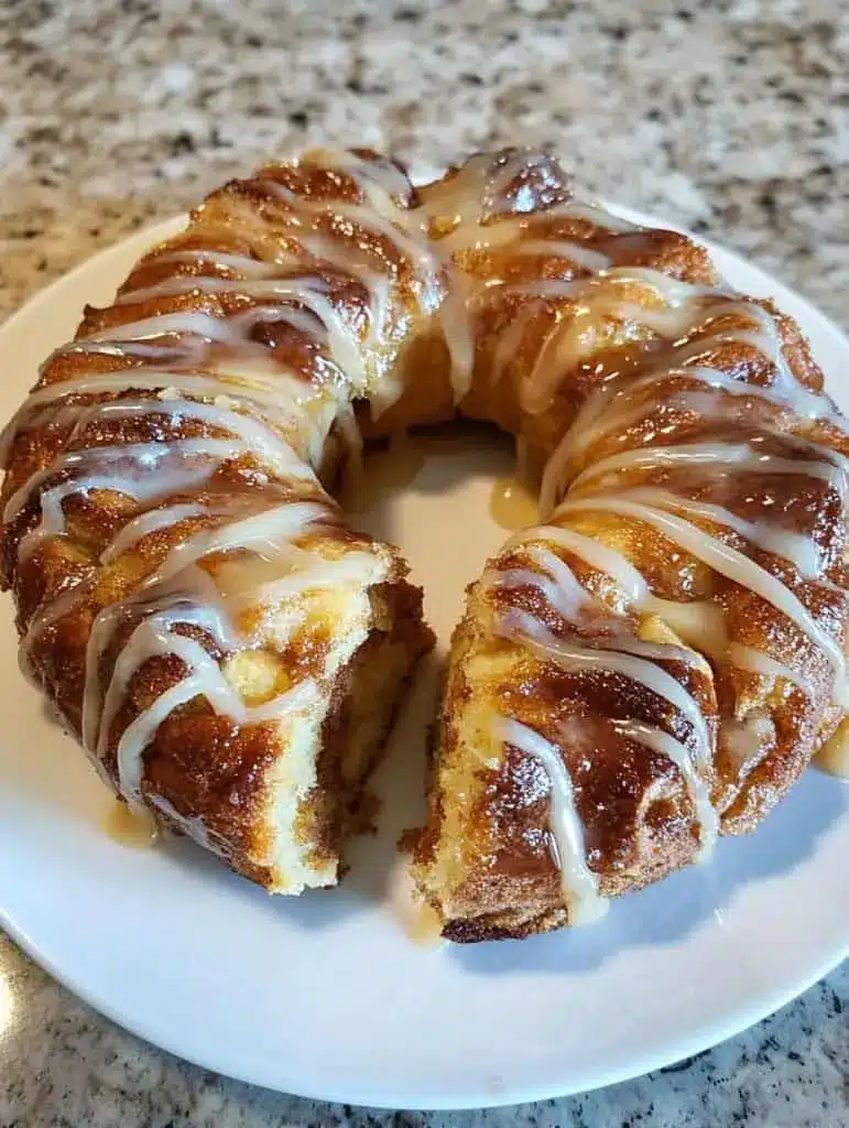 Close up of glazed Hawaiian roll monkey bread on a serving platter