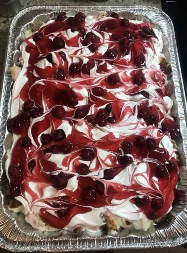 A slice of heaven on earth cake served on a plate, showing the distinct layers.