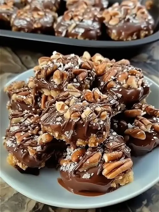Finished chocolate caramel nut clusters arranged on a platter ready for serving