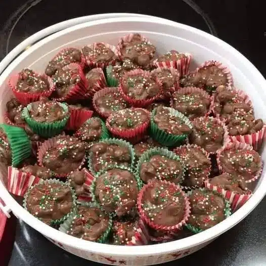 Finished christmas chocolate candy cups arranged on a festive holiday platter