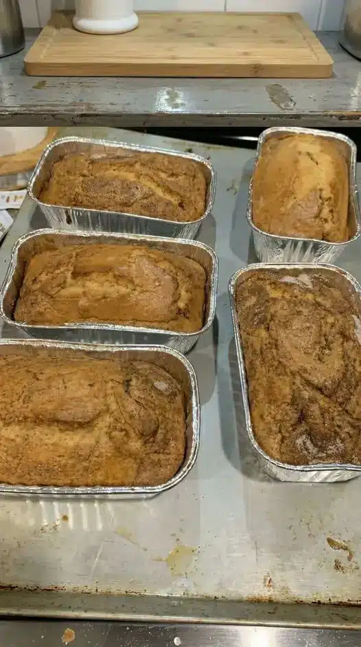 Close up slice of cinnamon roll bread showing the dark cinnamon spiral