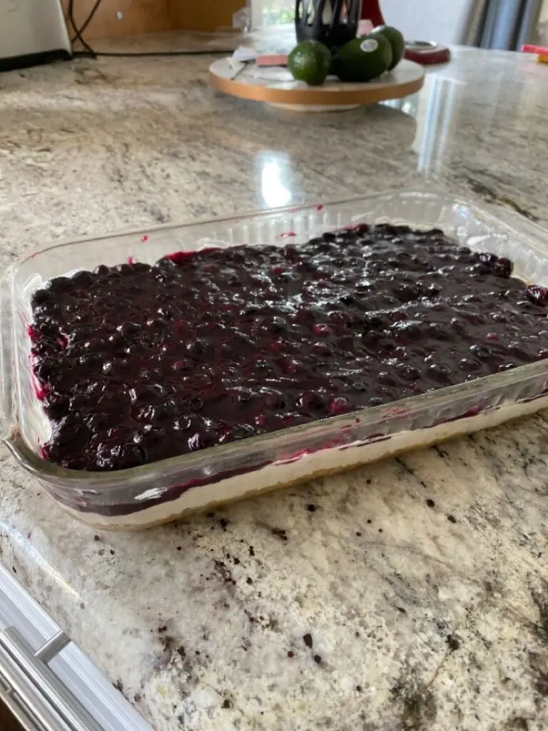 A slice of finished Blueberry Jamboree showing the distinct layers
