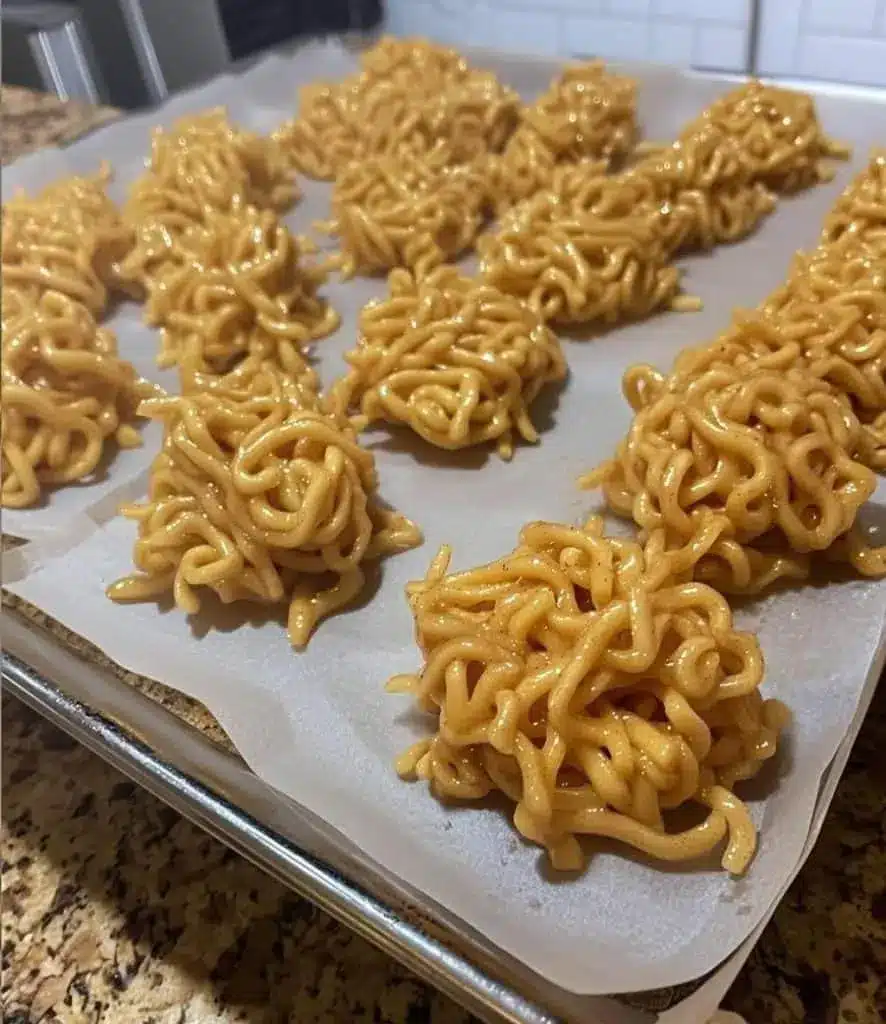 Finished no bake peanut butter haystacks set on parchment paper