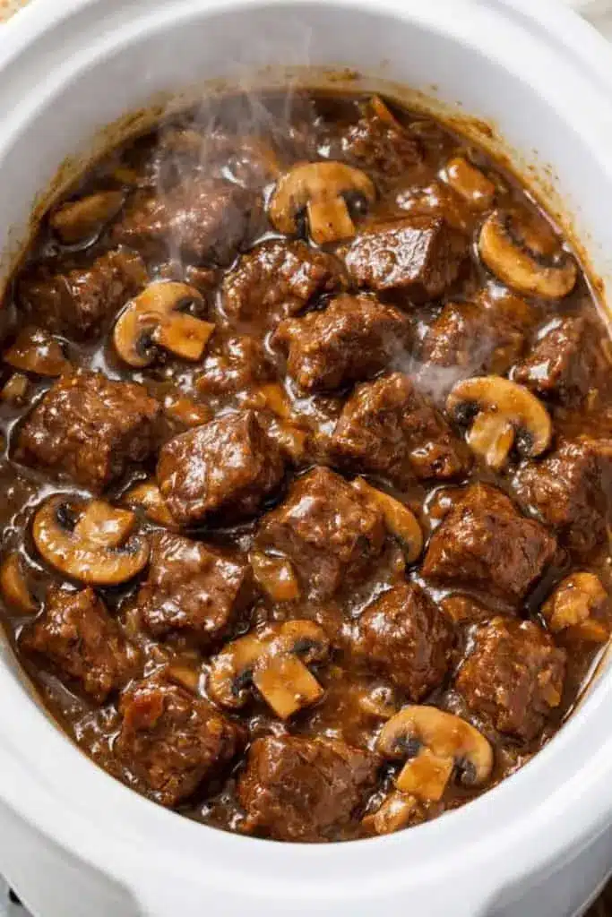 Beef tips and mushrooms served over creamy mashed potatoes