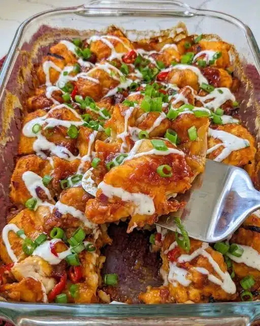 Close up of a serving of vegan bbq chicken bubble bake with melted cheese and fresh cilantro