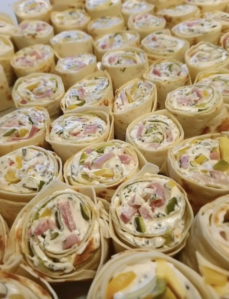 Platter of sliced vegetable cream cheese pinwheels ready to serve